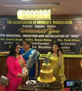yellow sari Actress Pankuri Awasthi cuts 24Karat Gold Leafed cake at inaugration of NGO WWC 1