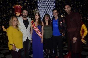 Deepak Tijori Mandeep Kaur and Sandip Soparrkar unveil the cover of WOW Magazine January issue8 1