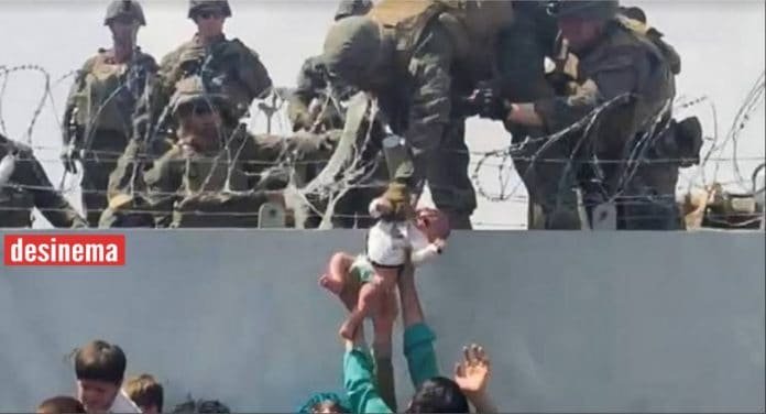 Heartbreaking video shows Afghan Women throw babies over fence to 'safety' fearing Taliban